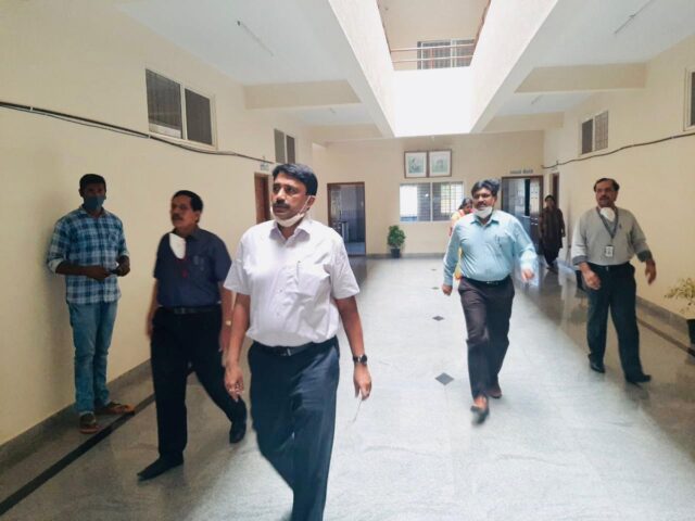 IAS officer G Kumar Naik conduction inspection at one of the quarantine centre