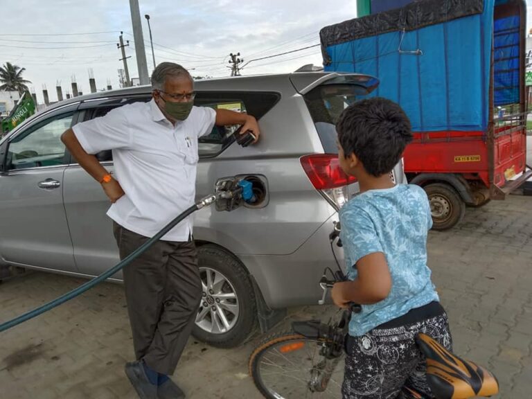 Education Minister Suresh Kumar interacting with one of the child.
