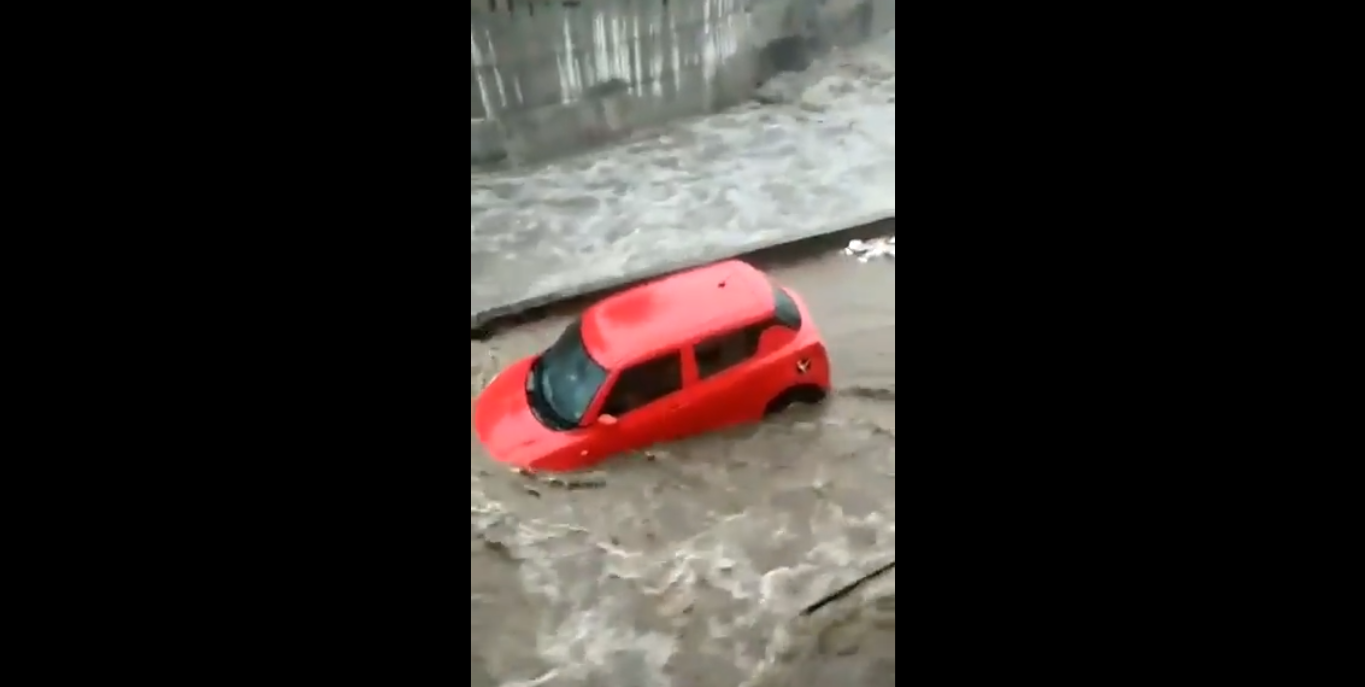 Flood water ‘toys’ with techie’s Maruti car Hosakerehalli’s storm water drain overflows with tidal force