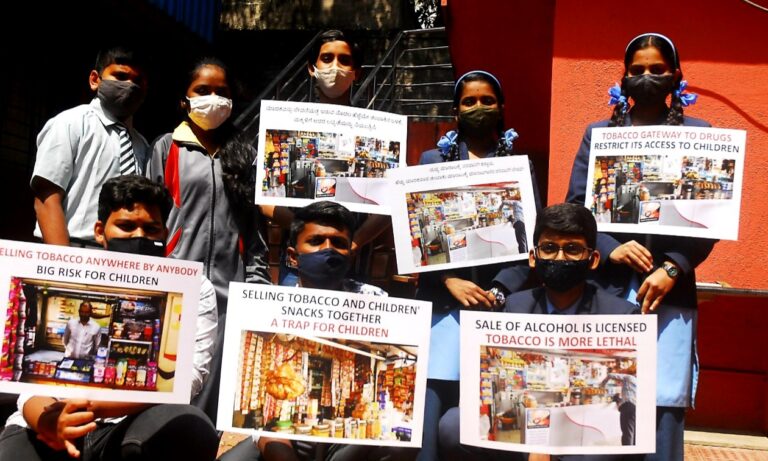 Children holding placards urging Vendor Licensing