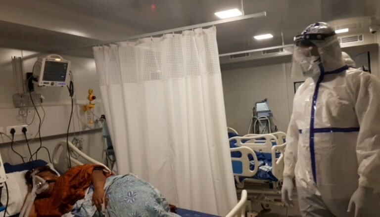 Karnataka DyCM wears PPE Kit and talks to Covid-19 infected patients