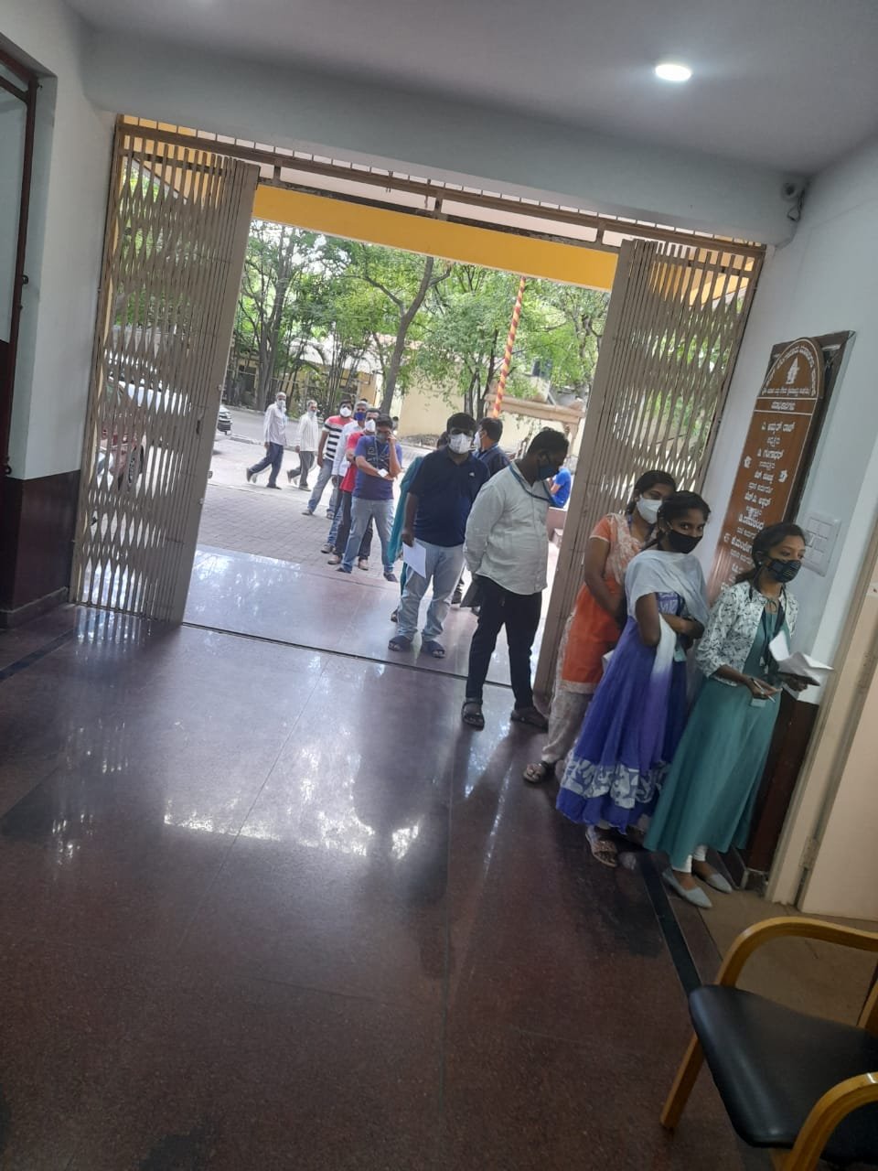 BBMP employees standing in queue for vaccination