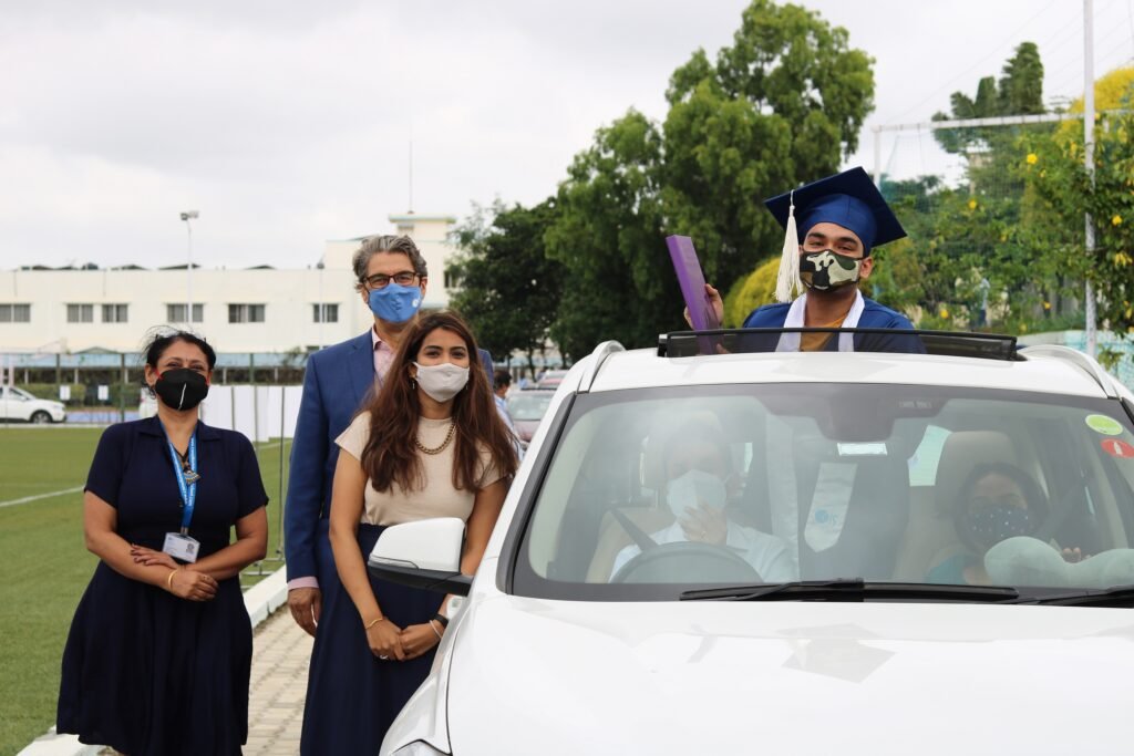 Resilient students finally get to celebrate drive thru graduation at Canadian International School