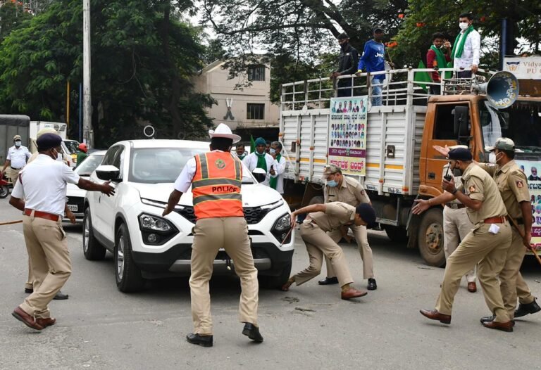 Protestor's car runs over Bengaluru DCP's foot!