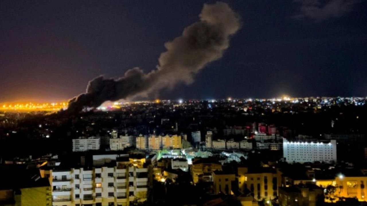 Israeli airstrikes hit Beirut suburbs, cut off key crossing into Syria