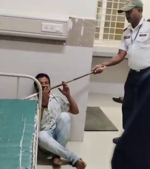 A man was allegedly subjected to a brutal assault by security personnel and police officers at HIMS Hospital after being accused of mobile phone theft.