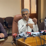 Krishna Byre Gowda addressing a media briefing with officials seated beside him