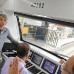 Namma Metro Pink Line train and officials during an inspection of the elevated corridor
