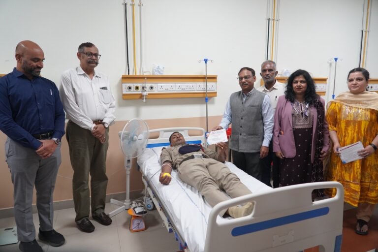 A donor receives an appreciation certificate during the blood donation camp at Divisional Railway Hospital, Bengaluru.