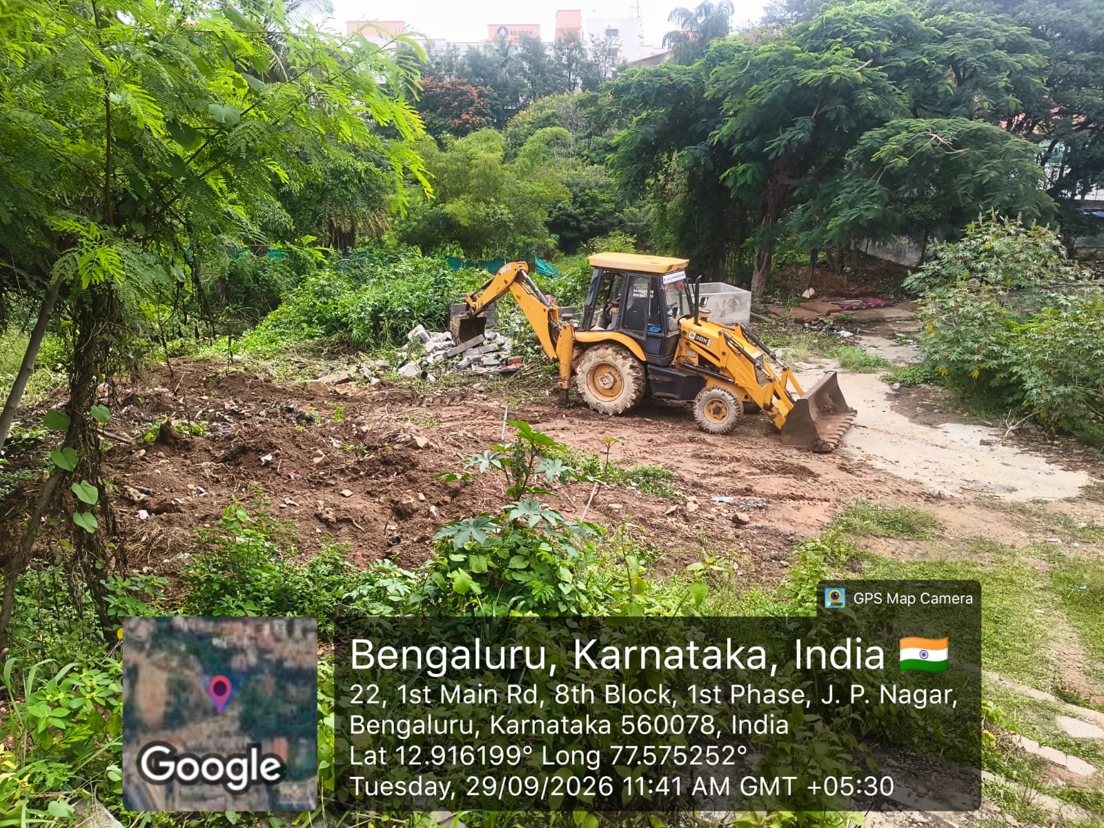 Earthmoving machinery at the land clearance site opposite Banashankari temple