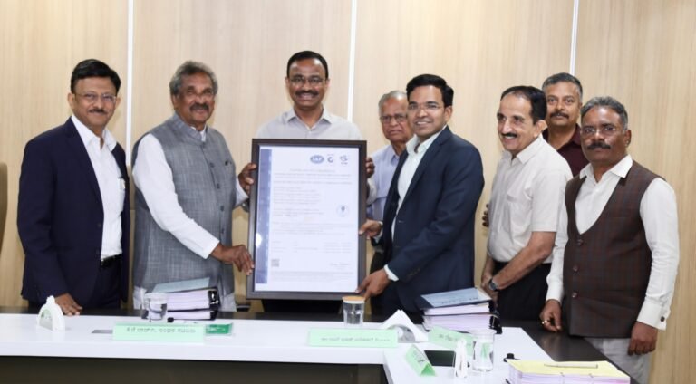 K.J. George and officials hold BESCOM’s information security certification at Energy Bhavan