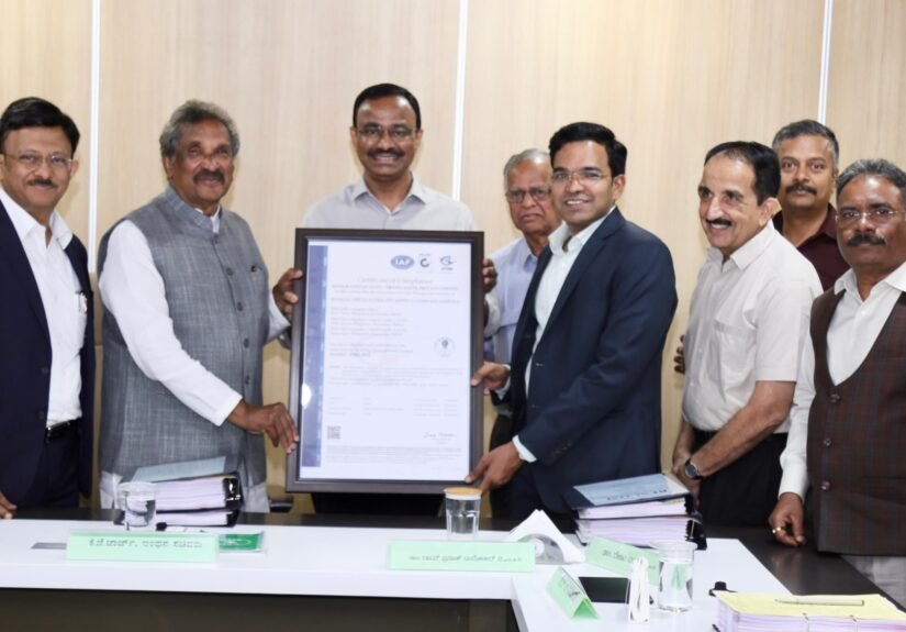 K.J. George and officials hold BESCOM’s information security certification at Energy Bhavan
