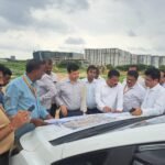 Bengaluru Urban district officials examine land records during the Kadagrahara government land recovery operation
