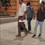 A masked man walking with two other men in the supplied image accompanying the Bengaluru fake medicine case report