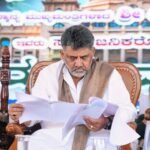 Chief Minister D.K. Shivakumar reviews documents at the Kasturirangan report public consultation in Sakleshpur