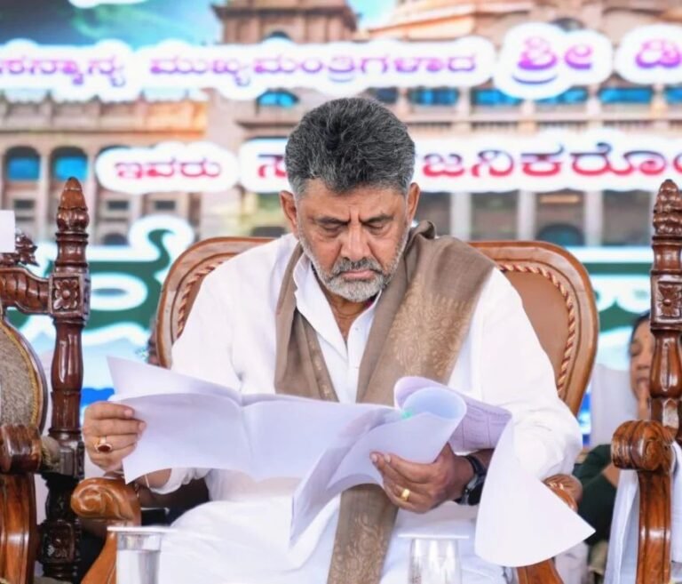 Chief Minister D.K. Shivakumar reviews documents at the Kasturirangan report public consultation in Sakleshpur