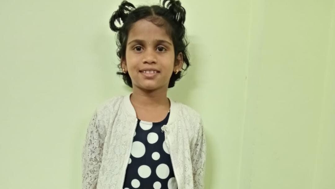 Pavithra, pictured in the official appeal to trace her parents