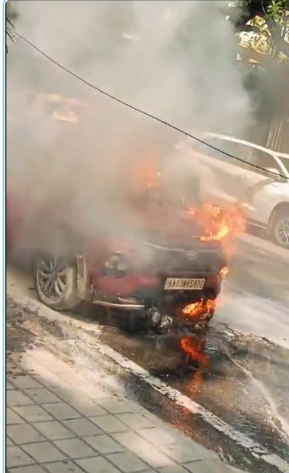 Flames and smoke rise from a red car in the Cunningham Road incident video