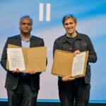 Karnataka and ElevenLabs representatives display the signed MoU