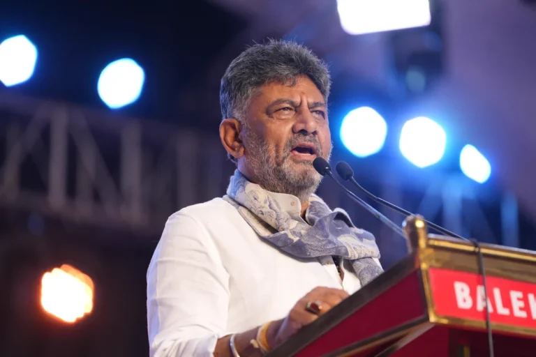 Chief Minister D. K. Shivakumar speaks at a podium during the Kittur Utsav.