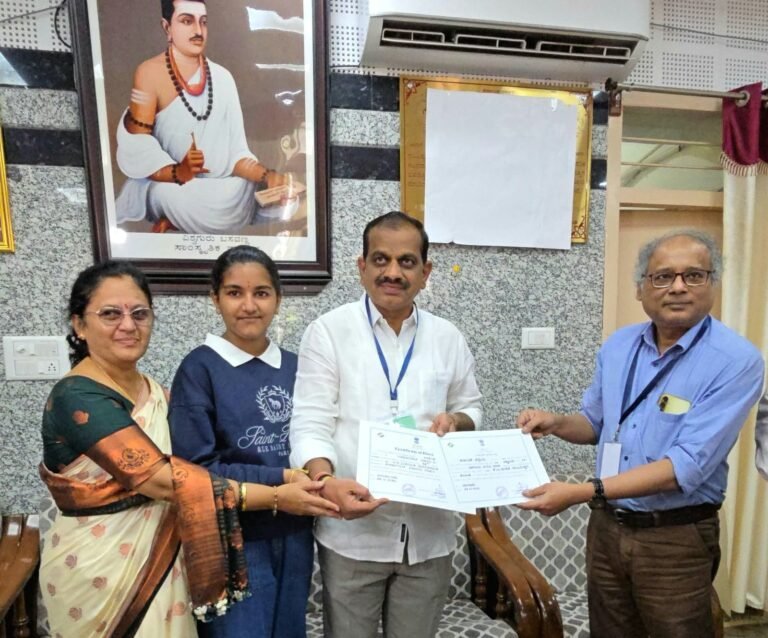 K M Suresha receives his election certificate after winning the Karnataka South-East Graduates constituency.