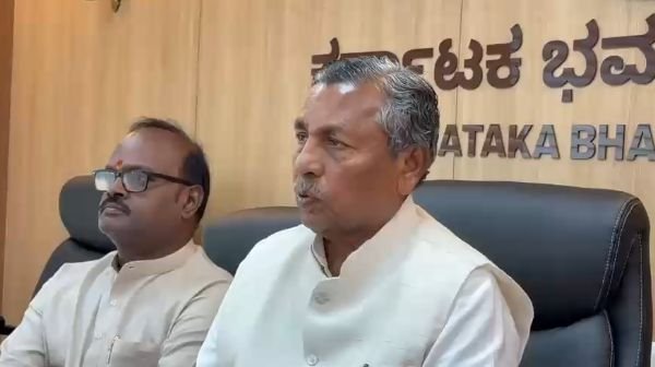 K.H. Muniyappa addressing reporters at Karnataka Bhavan, frame from the source video.