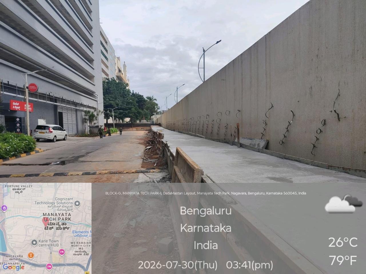 Bengaluru North Builds 1.6-Km Drain Link Near Manyata, Uses Sensor Pumps in Low-Lying Layout 2 Drainage works beside a road at Manyata Tech Park