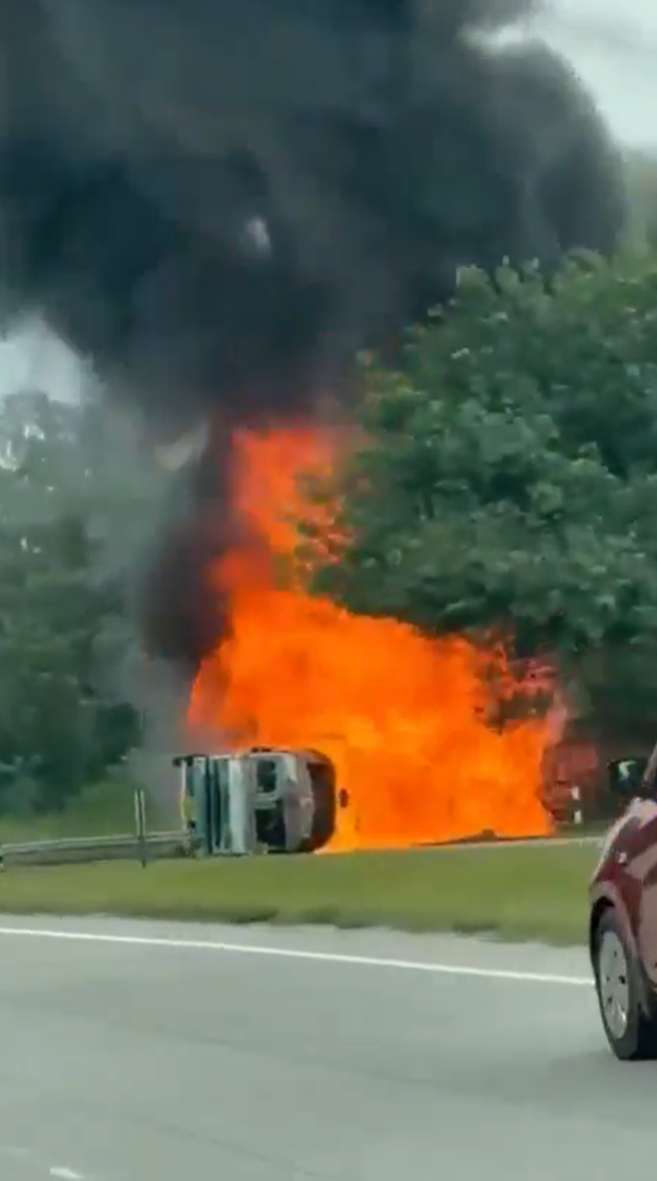 An overturned tanker burns on NICE Road near Kanakapura Road toll
