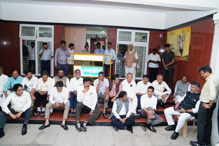 DK Shivakumar and other leaders staging a dharna on the steps of the CEO office in Bengaluru