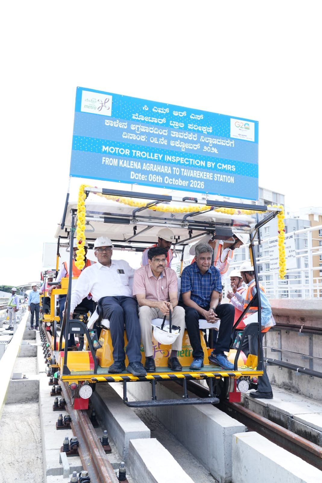 Namma Metro Pink Line CMRS inspection team on a motor trolley between Kalena Agrahara and Tavarekere