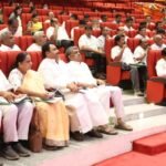 Congress leaders and participants seated at a gathering in Karnataka