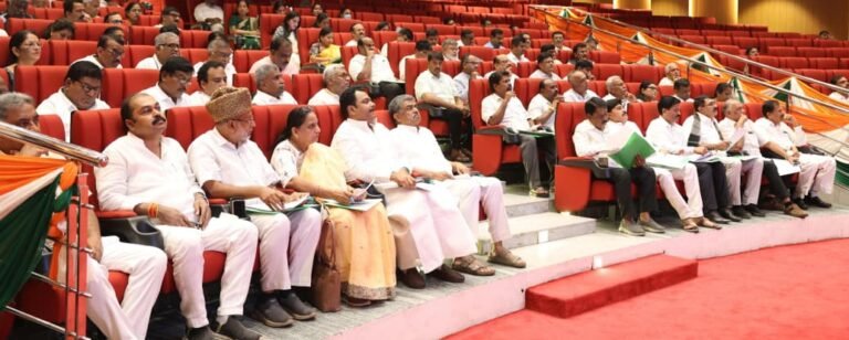 Congress leaders and participants seated at a gathering in Karnataka
