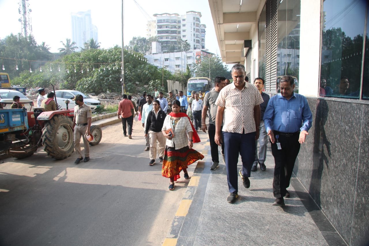 Officials inspect pedestrian access along Bannerghatta Road near a Metro station in Bengaluru.