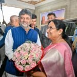 D.K. Shivakumar and Sudha Yadav with a bouquet at the welcome programme
