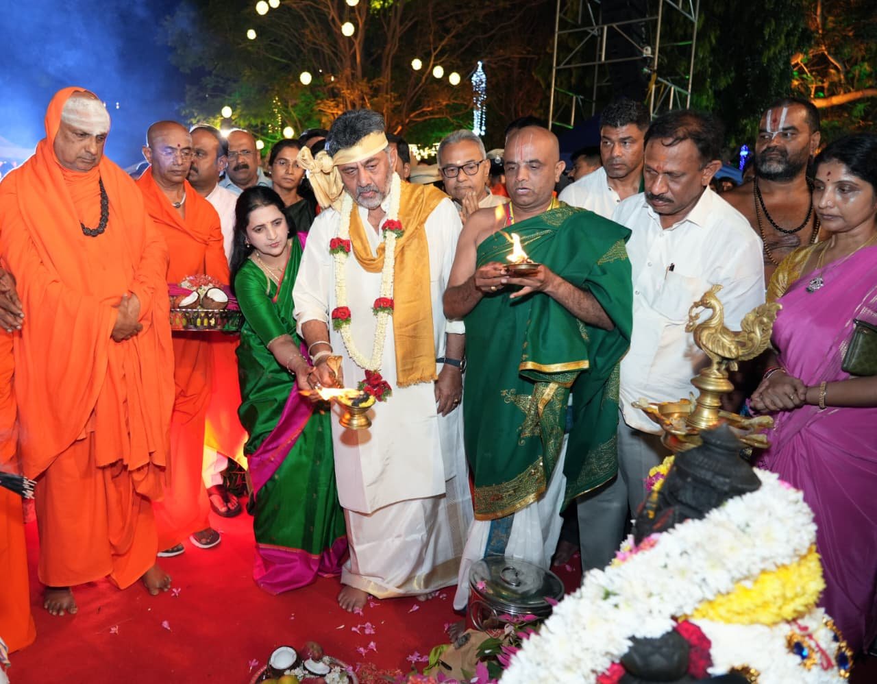 D.K. Shivakumar and Usha offer prayers during the Cauvery Aarti at KRS Brindavan Gardens
