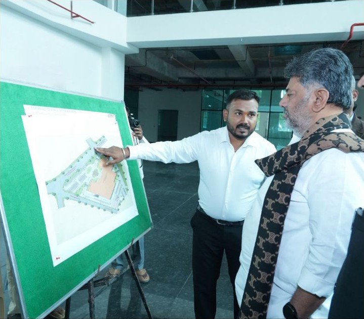 D K Shivakumar and Priyank Kharge review a plan during the police command-centre project visit