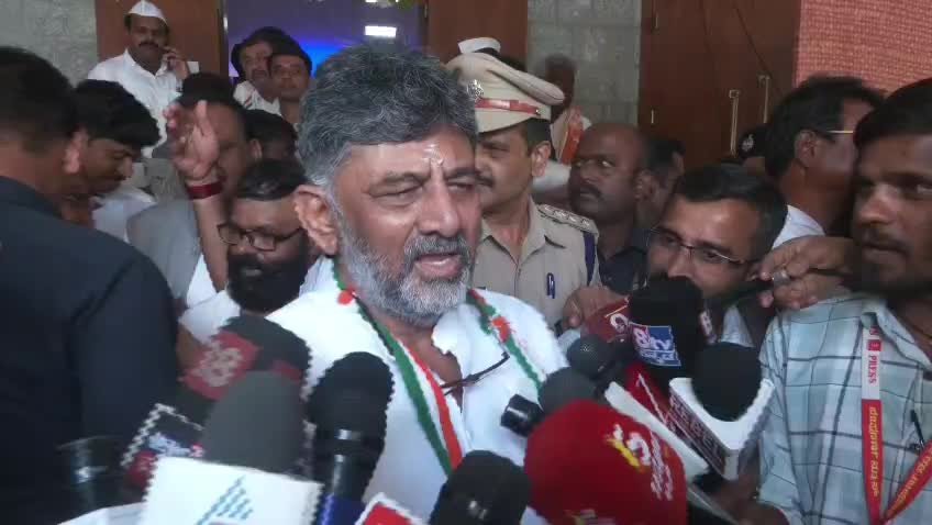 D.K. Shivakumar speaking to reporters near Gandhi Bhavan in Bengaluru