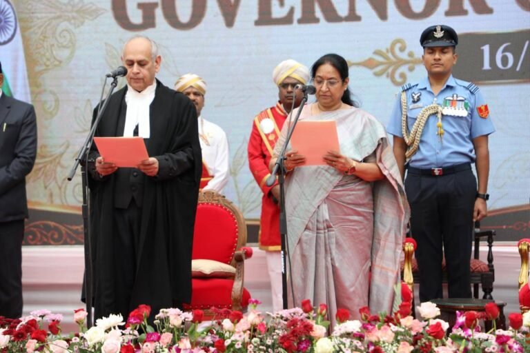 Dr Sudha Yadav reads the oath beside Karnataka High Court Chief Justice Vibhu Bakhru at Lok Bhavan in Bengaluru.