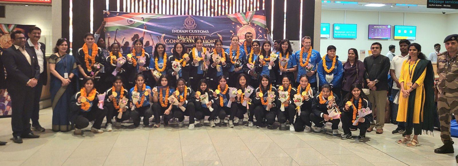 Indian women hockey team and officials at the Bengaluru airport welcome after Asian Games gold