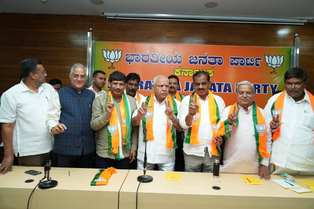 B S Yediyurappa speaks to the media alongside BJP leaders at a Bengaluru press conference.